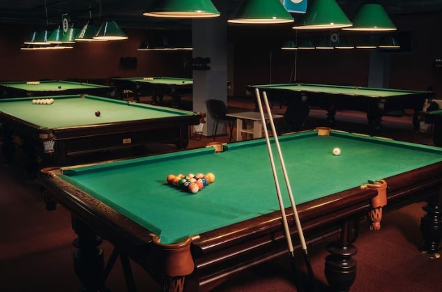Billiard tables with green surfaces