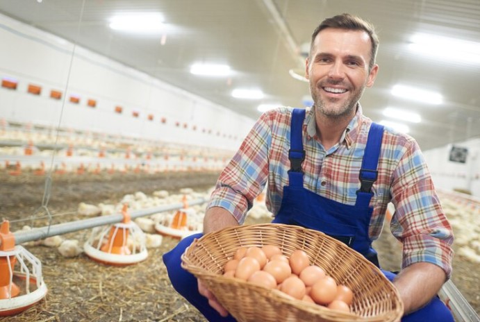 A happy poultry farmer